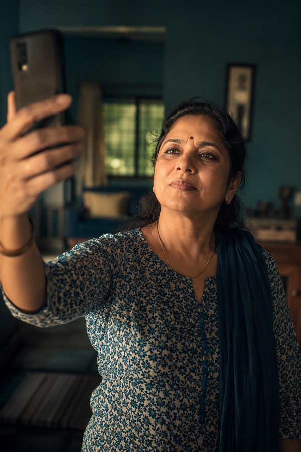 Holding a phone at arm's length to read